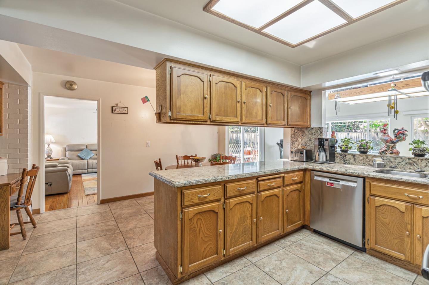 2696 Birchtree Lane Santa Clara, CA 95051 - Photo 13 of 56 a kitchen with a sink window and cabinets