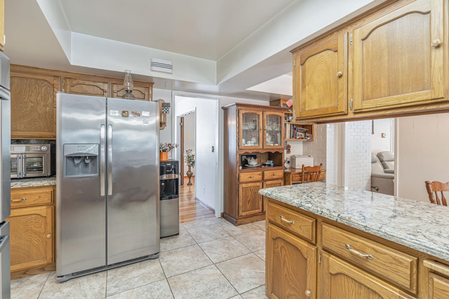 2696 Birchtree Lane Santa Clara, CA 95051 - Photo 14 of 56 a kitchen with granite countertop a refrigerator and cabinets