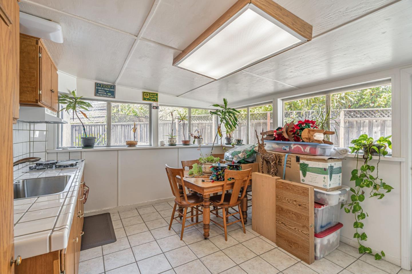 2696 Birchtree Lane Santa Clara, CA 95051 - Photo 15 of 56 a dining room filled with furniture and a potted plant