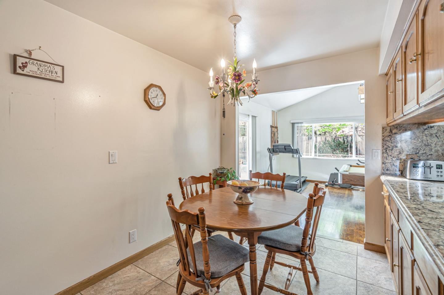 2696 Birchtree Lane Santa Clara, CA 95051 - Photo 17 of 56 a view of a dining room with furniture and a chandelier