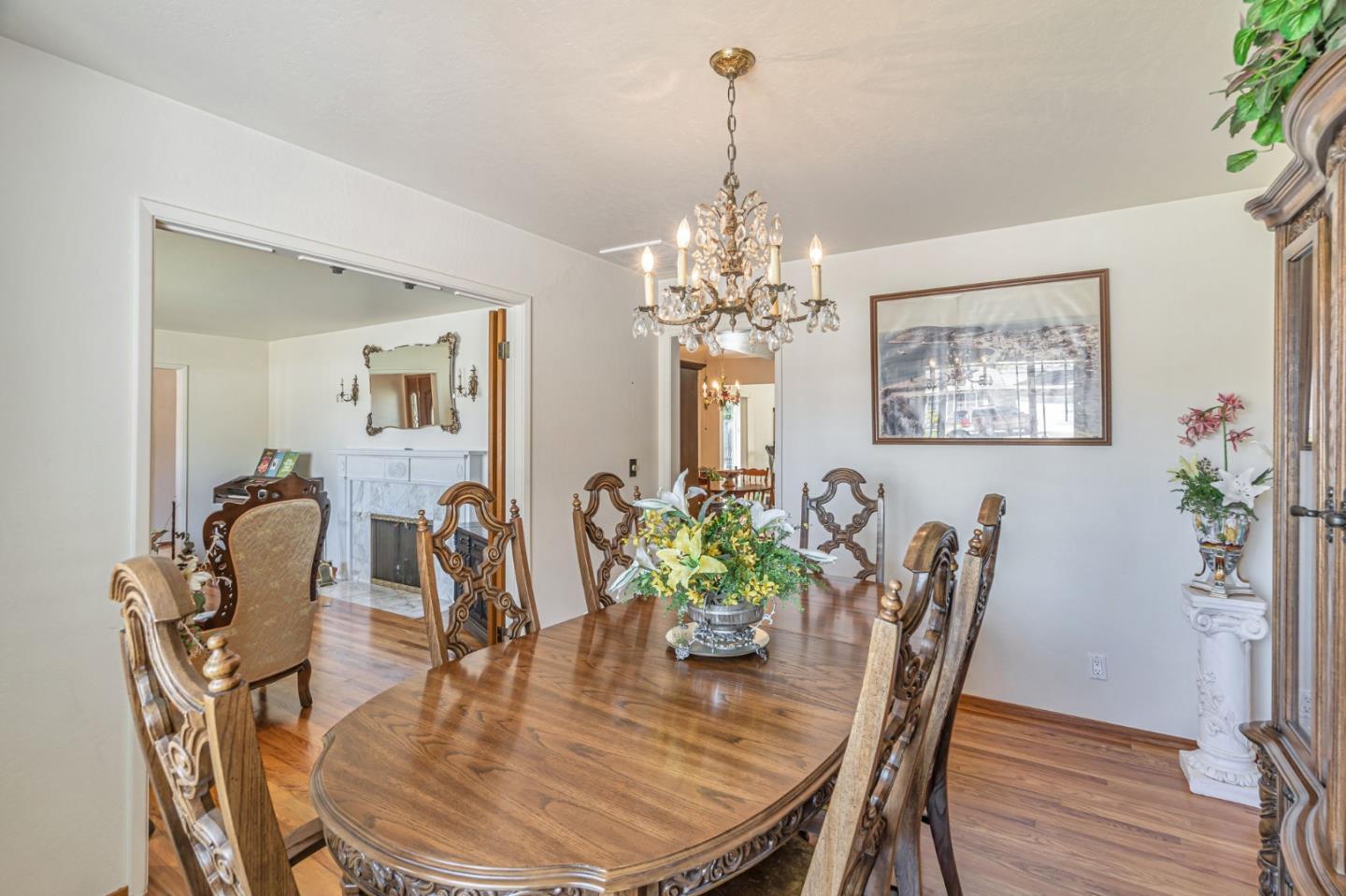 2696 Birchtree Lane Santa Clara, CA 95051 - Photo 18 of 56 a dining room with furniture a chandelier and wooden floor