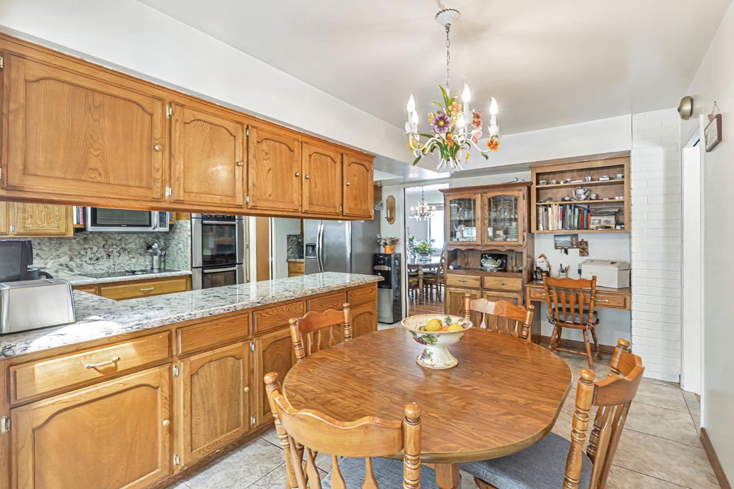 2696 Birchtree Lane Santa Clara, CA 95051 - Photo 19 of 56 a view of a dining room with furniture a chandelier and wooden floor