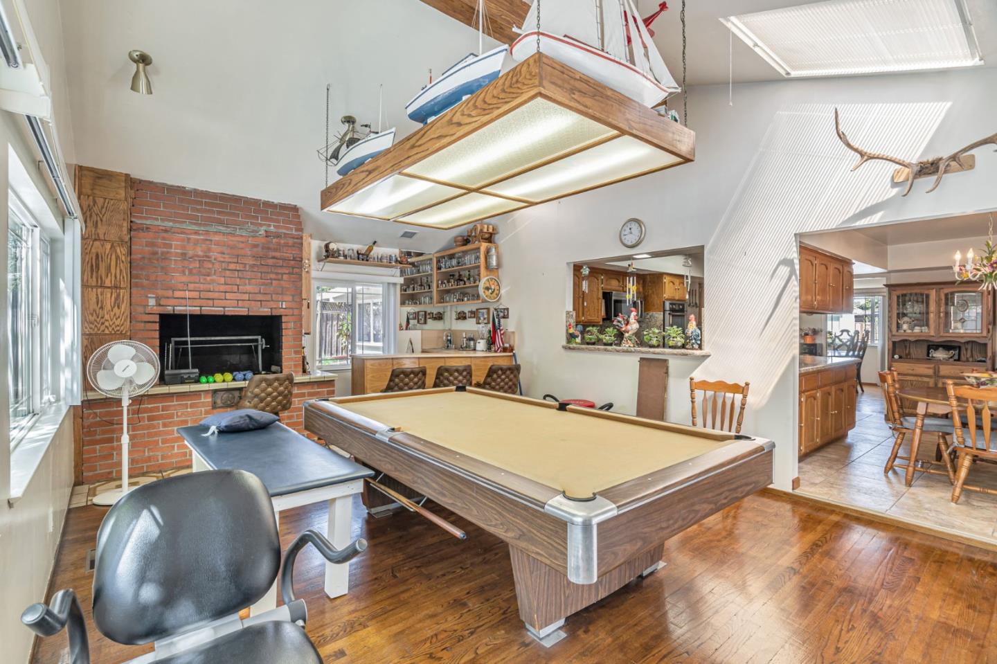 2696 Birchtree Lane Santa Clara, CA 95051 - Photo 23 of 56 a living room with furniture a flat screen tv and a fireplace