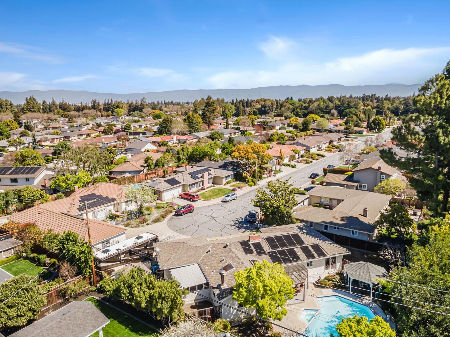 2696 Birchtree Lane Santa Clara, CA 95051 - Photo 56 of 56 an aerial view of a city with lots of residential buildings and mountain view in back
