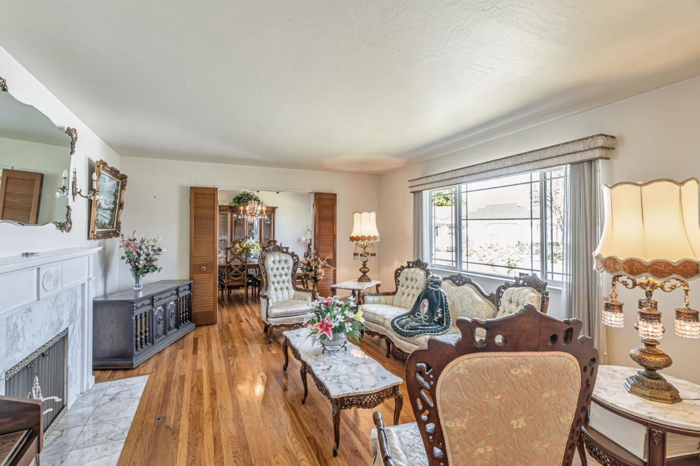 2696 Birchtree Lane Santa Clara, CA 95051 - Photo 6 of 56 a living room with fireplace furniture and a large window
