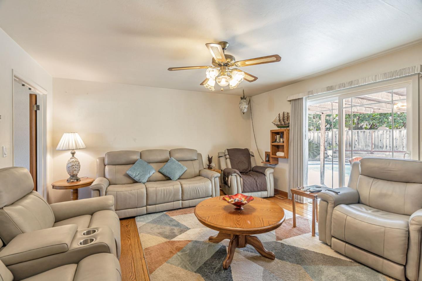 2696 Birchtree Lane Santa Clara, CA 95051 - Photo 9 of 56 a living room with furniture and a large window