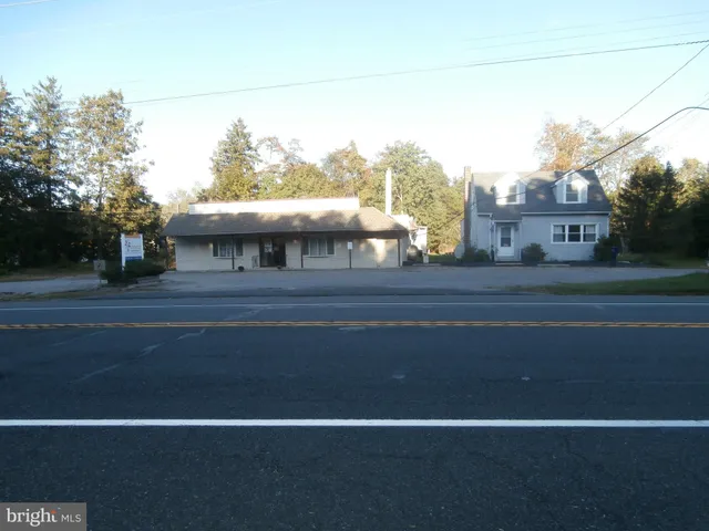 a view of a building and trees in the background