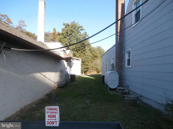 a view of a back yard of the house