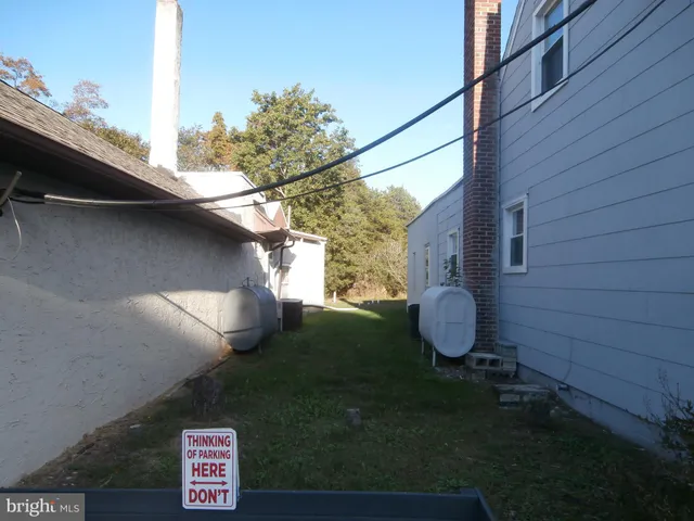a view of a back yard of the house
