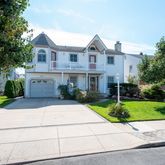 an aerial view of a house with a lake view