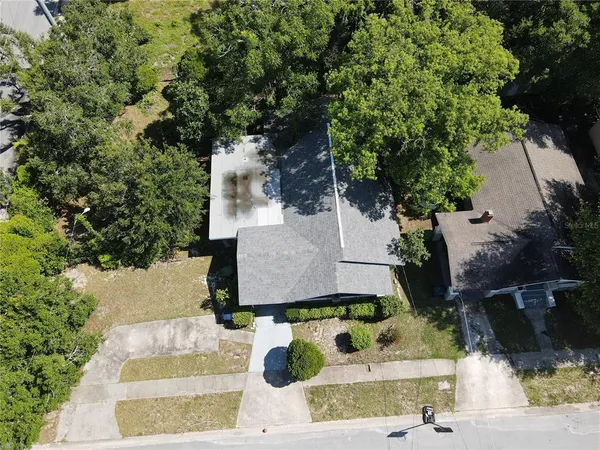an aerial view of a house with swimming pool
