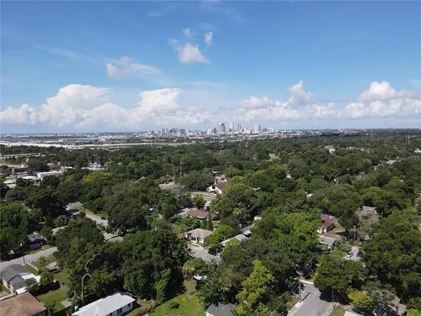 an aerial view of a city and mountain view in back
