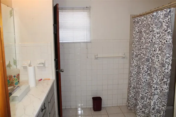 a bathroom with a sink and a shower