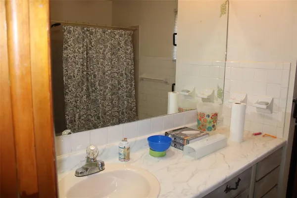 a bathroom with a sink and a mirror