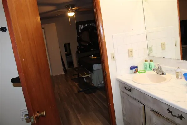 a bathroom with a sink and a mirror