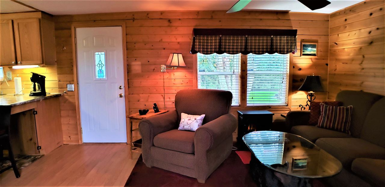 1573 Burkett Road Dixon, IL 61021 - Photo 11 of 25 a living room with furniture a lamp and a large window