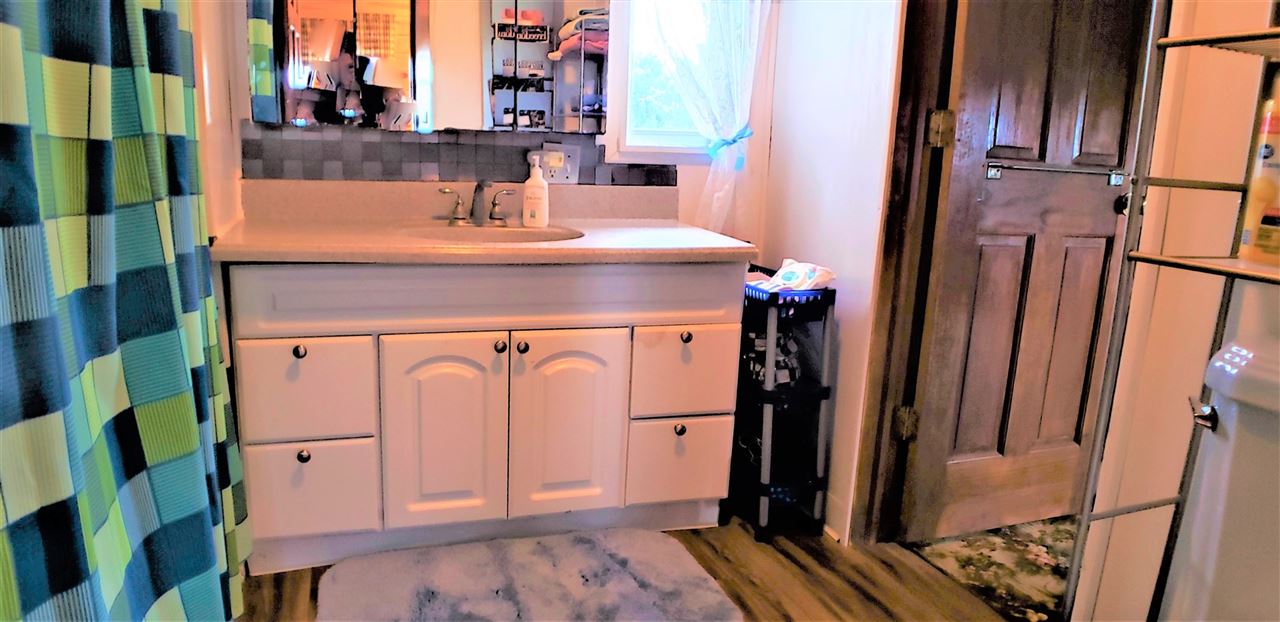 1573 Burkett Road Dixon, IL 61021 - Photo 16 of 25 a view of a hallway with a washer and dryer