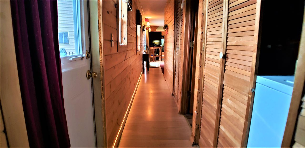 1573 Burkett Road Dixon, IL 61021 - Photo 18 of 25 a view of a hallway with wooden floor and stairs
