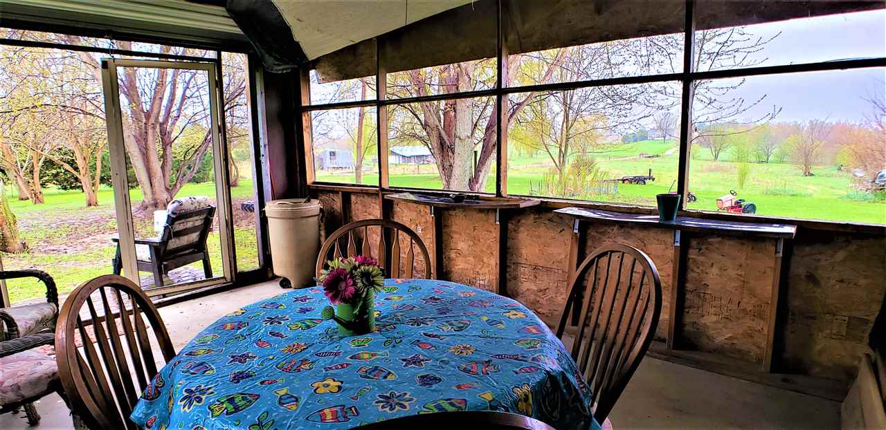 1573 Burkett Road Dixon, IL 61021 - Photo 22 of 25 a view of a dining room with furniture window and outside view