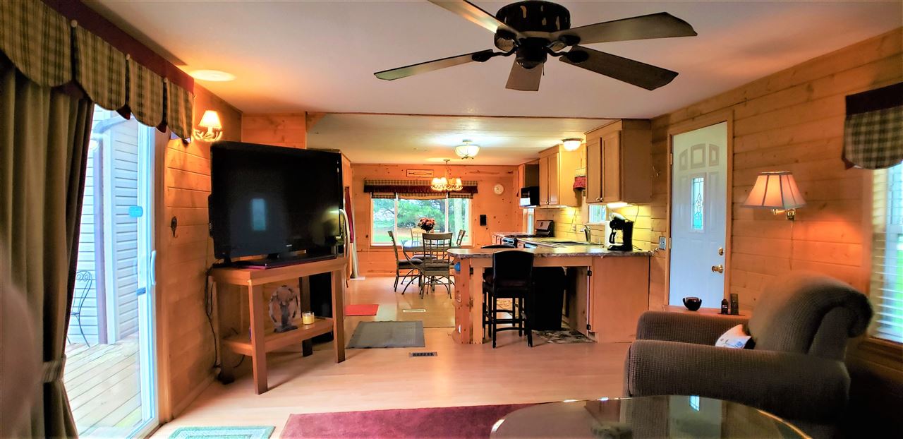 1573 Burkett Road Dixon, IL 61021 - Photo 9 of 25 a living room with furniture and a flat screen tv