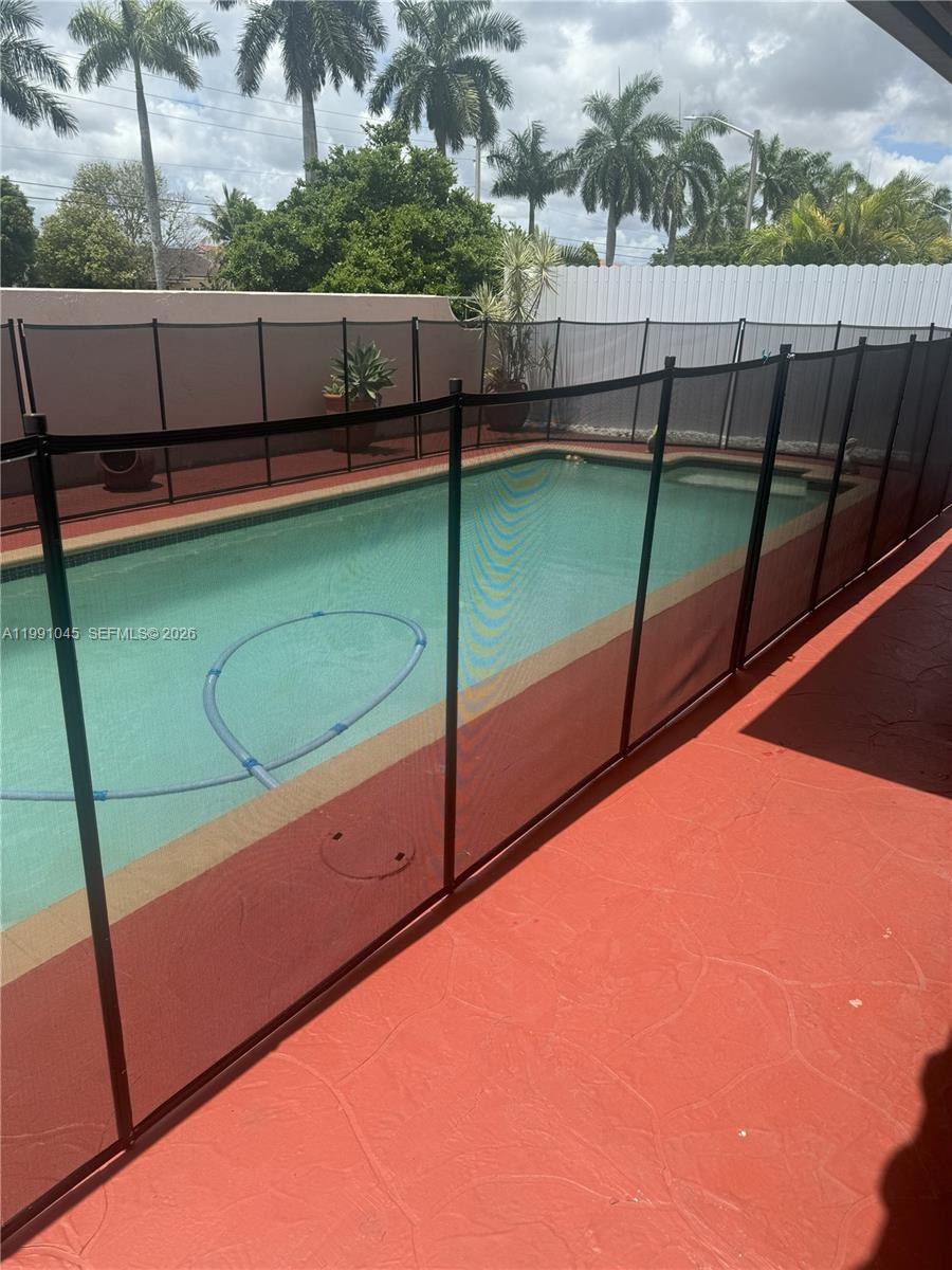 15318 Southwest 41st Terrace Miami, FL 33185 - Photo 1 of 30 a view of a tennis court