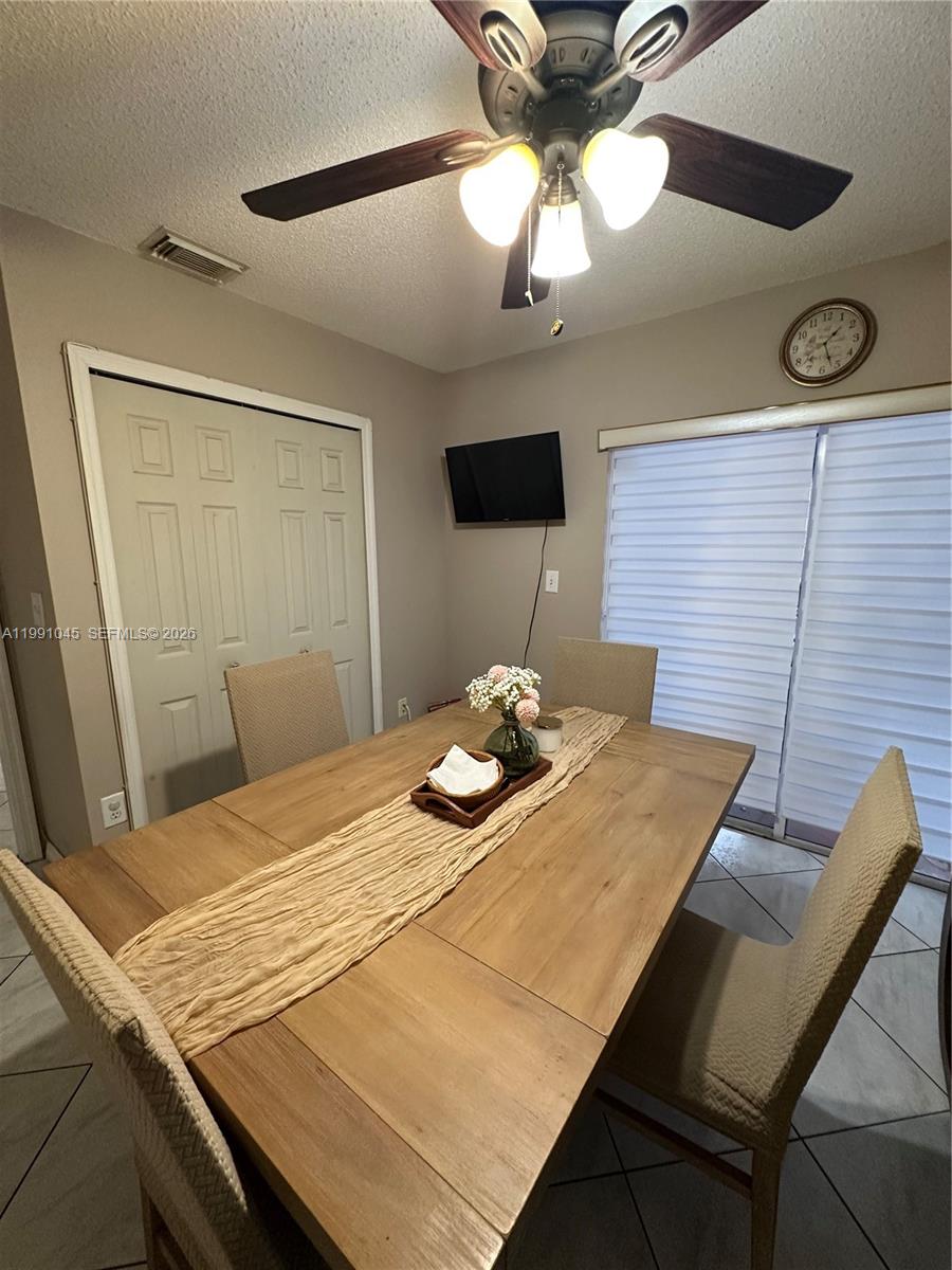 15318 Southwest 41st Terrace Miami, FL 33185 - Photo 12 of 30 a bedroom with a bed and a table