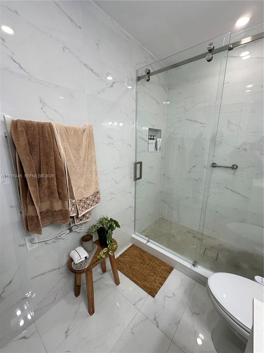 15318 Southwest 41st Terrace Miami, FL 33185 - Photo 17 of 30 a bathroom with a toilet and a shower