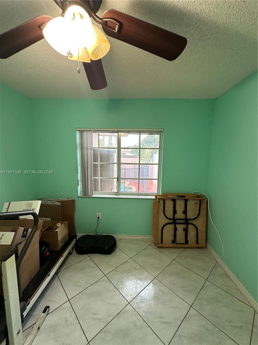 15318 Southwest 41st Terrace Miami, FL 33185 - Photo 20 of 30 a room with green walls and a window