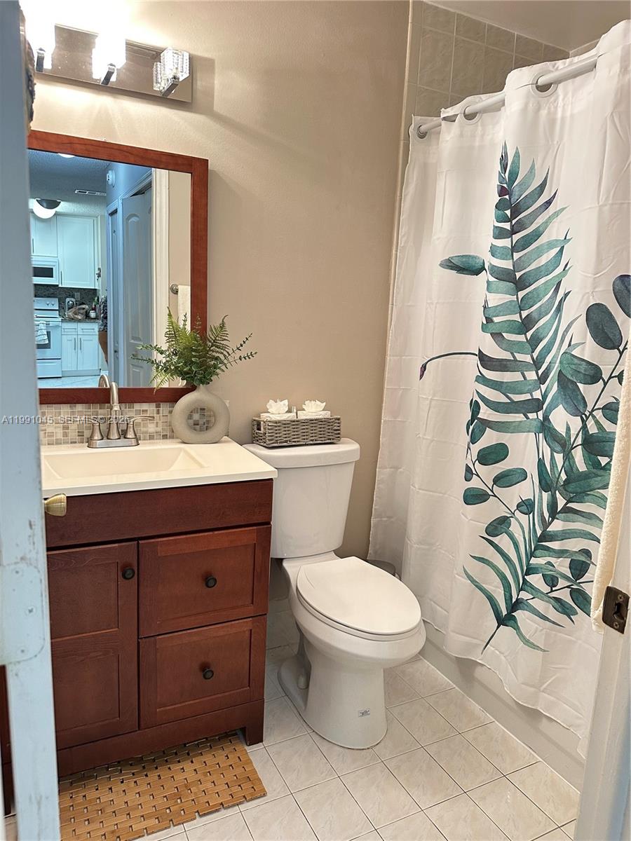 15318 Southwest 41st Terrace Miami, FL 33185 - Photo 22 of 30 a bathroom with a sink toilet and shower