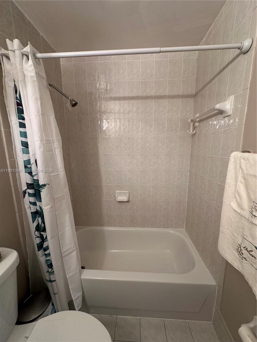 15318 Southwest 41st Terrace Miami, FL 33185 - Photo 23 of 30 a bathroom with a shower and a toilet