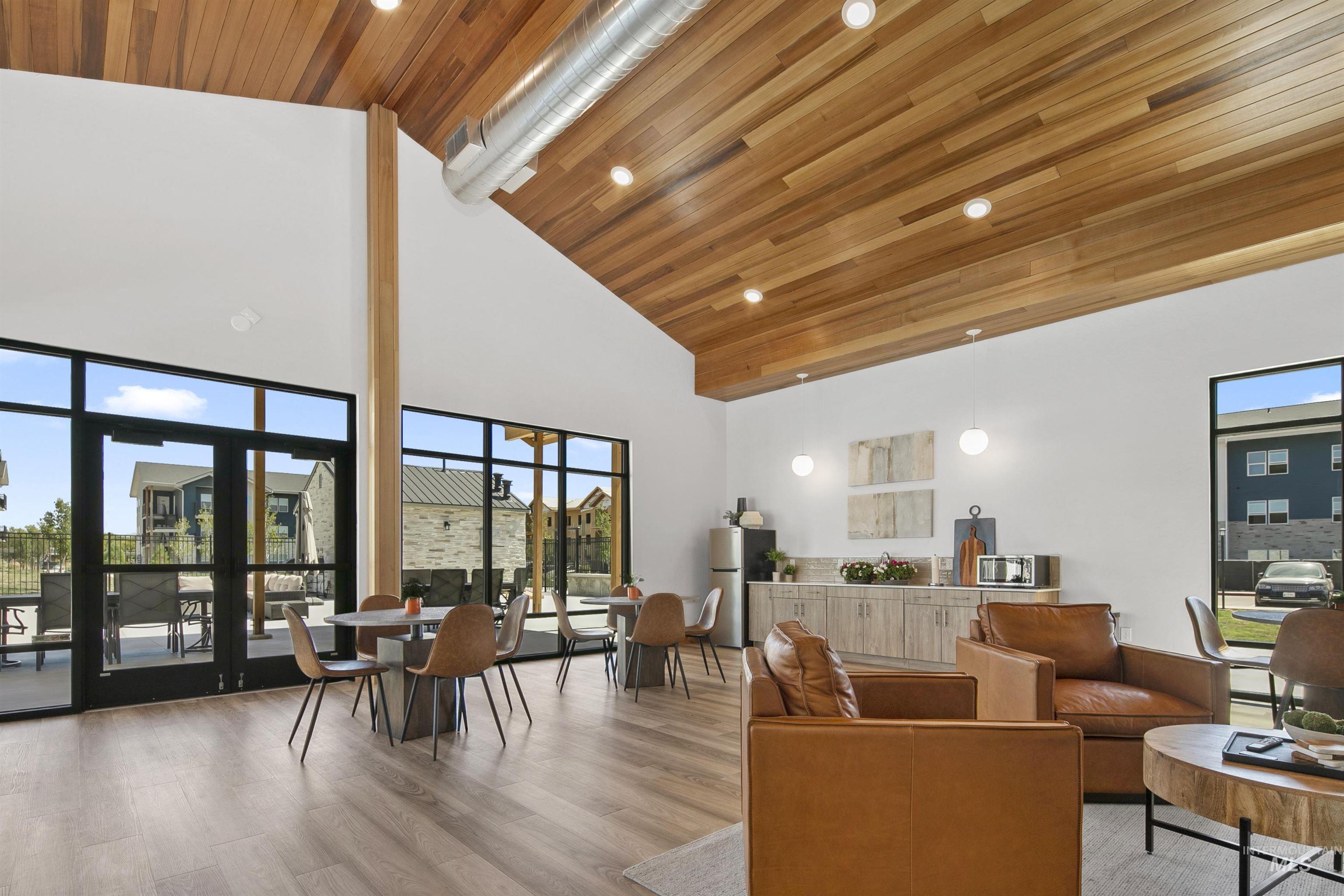 755 West Wrangler Street Meridian, ID 83646 - Photo 31 of 35 Spacious common area featuring an exposed wood-finish ceiling, vaulted white walls, and large windows