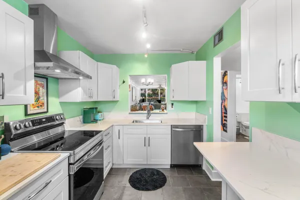 a kitchen with a sink and cabinets