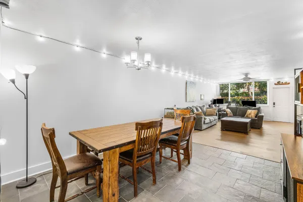 a dining room with furniture and window