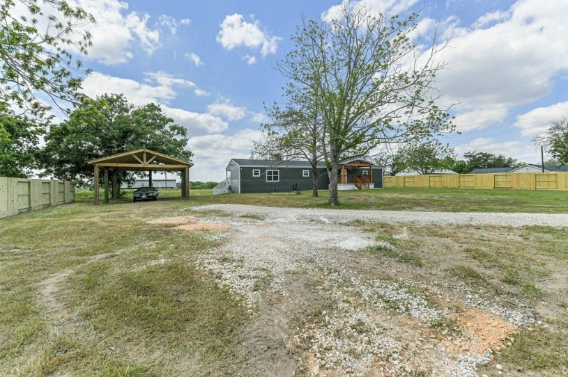 9137 Conner Road Washington, TX 77880 - Photo 2 of 49 a view of a house with a yard