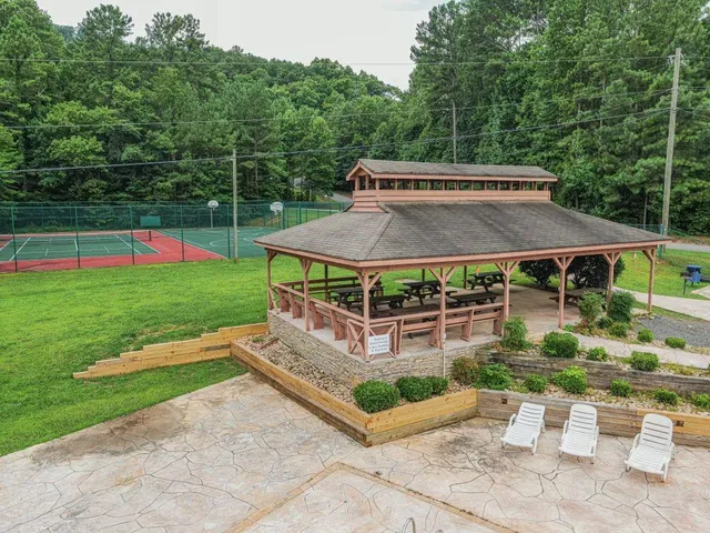 a view of a backyard with sitting area