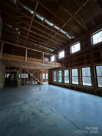 a view of an empty room with windows