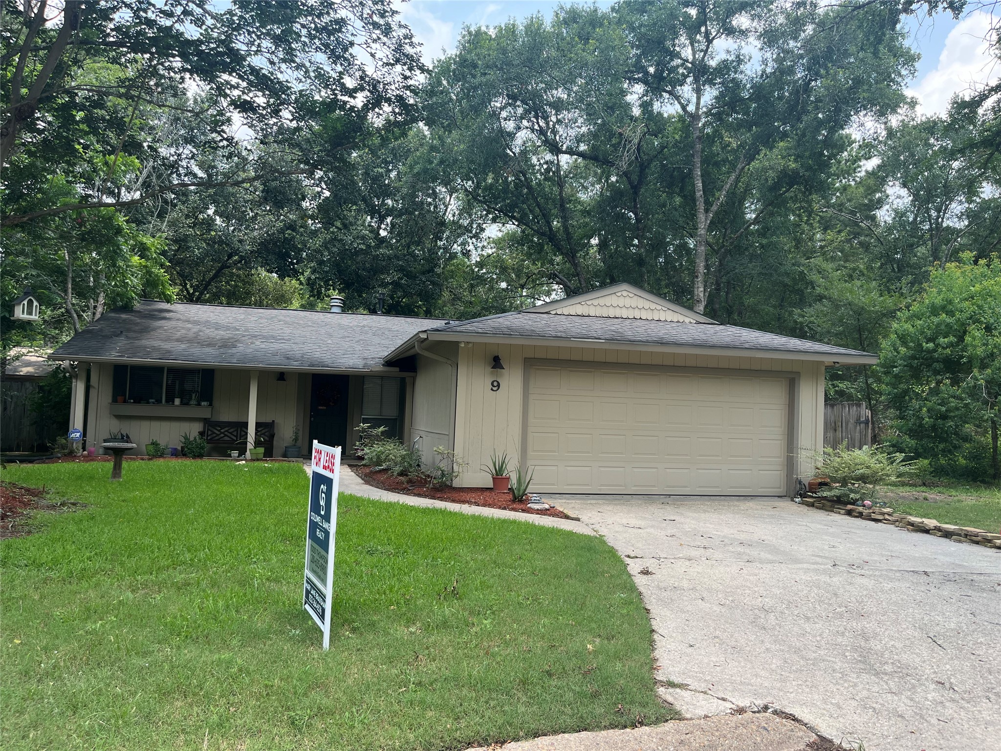 9 Wolfhound Lane The Woodlands, TX 77380 - Photo 1 of 20 Darling elevation with covered front porch, flower box and landscaped yard.