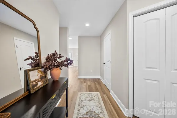 a hallway with white flowers