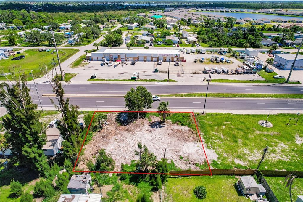 3220 Placida Road Englewood, FL 34224 - Photo 6 of 8 a view of a yard with an outdoor space