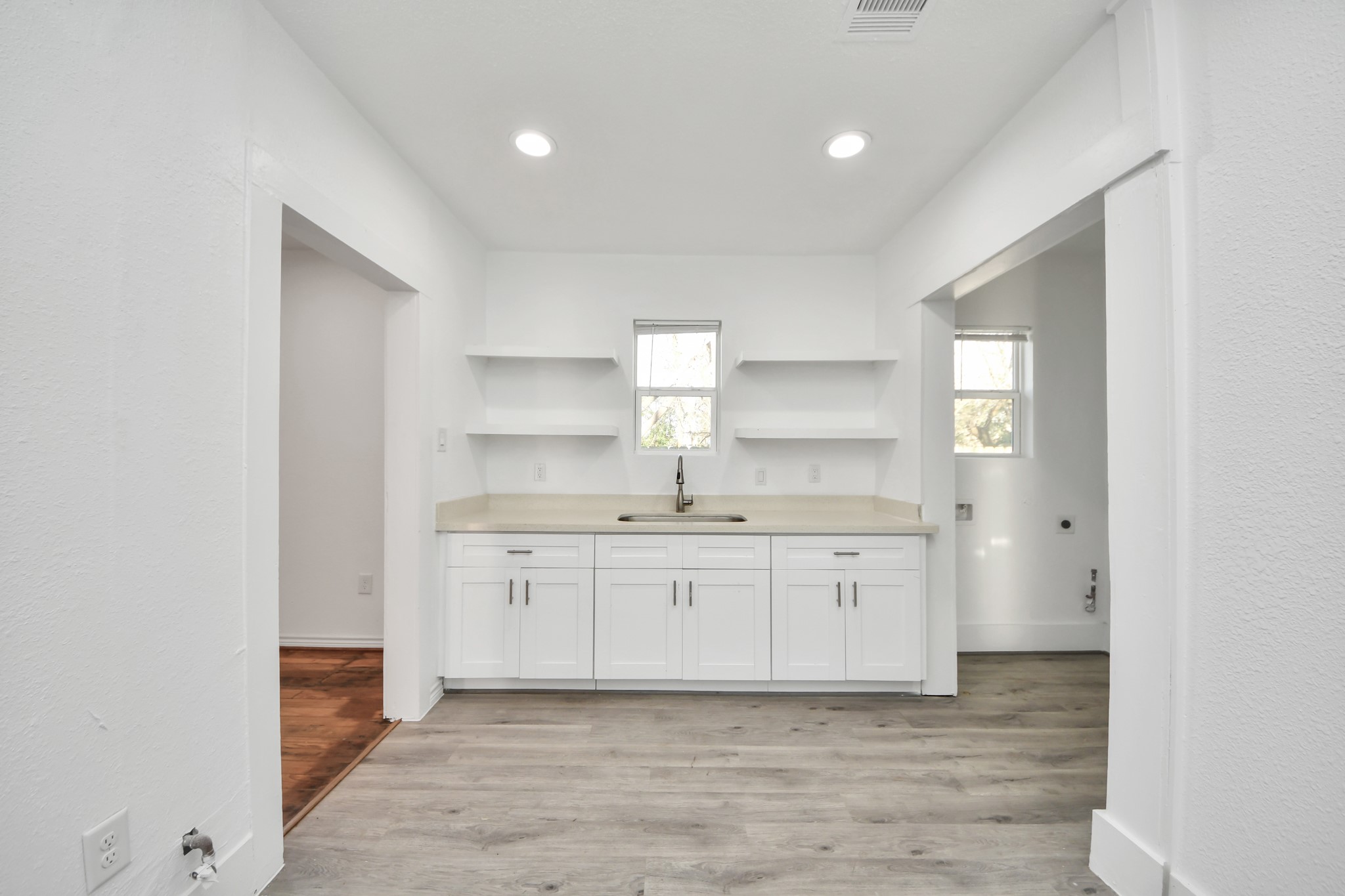 3423 Beulah Street Houston, TX 77004 - Photo 11 of 36 a bathroom with a granite countertop sink and a mirror