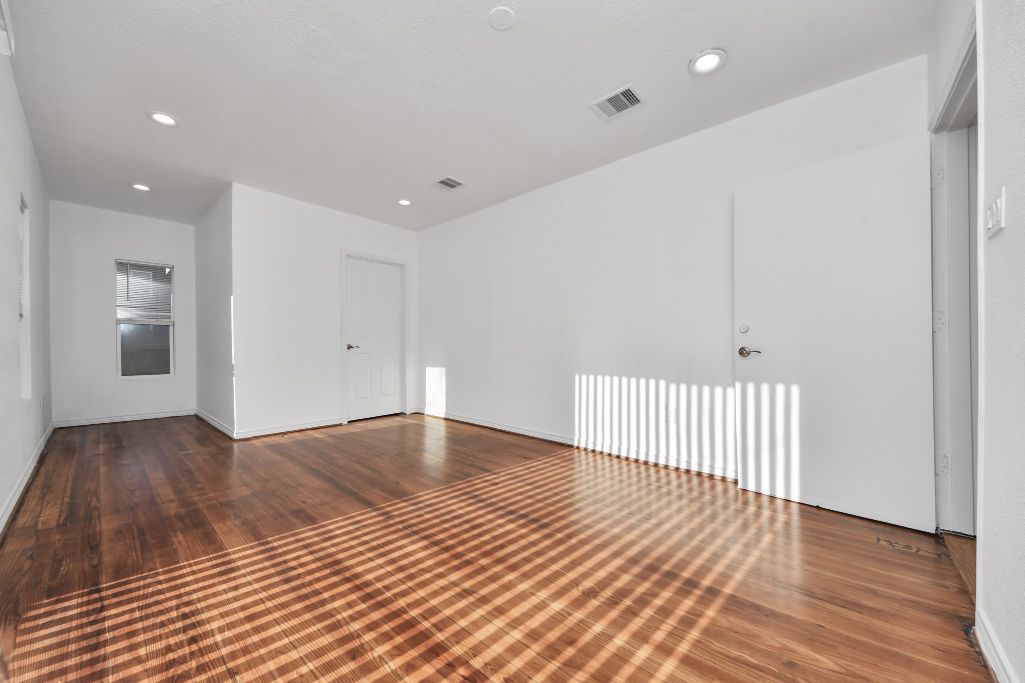 3423 Beulah Street Houston, TX 77004 - Photo 21 of 36 a view of a room with wooden floor and staircase