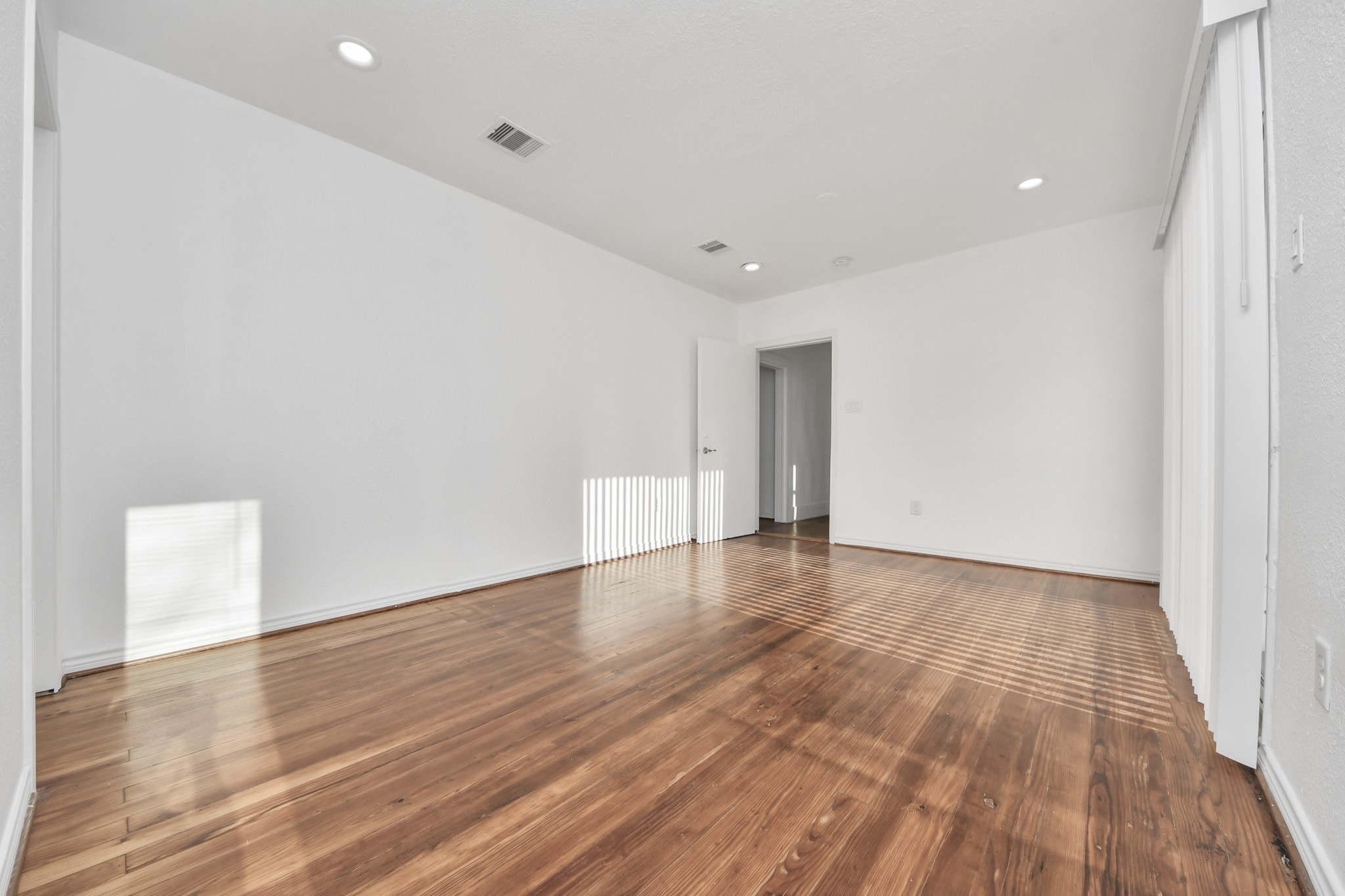 3423 Beulah Street Houston, TX 77004 - Photo 22 of 36 a view of an empty room with wooden floor