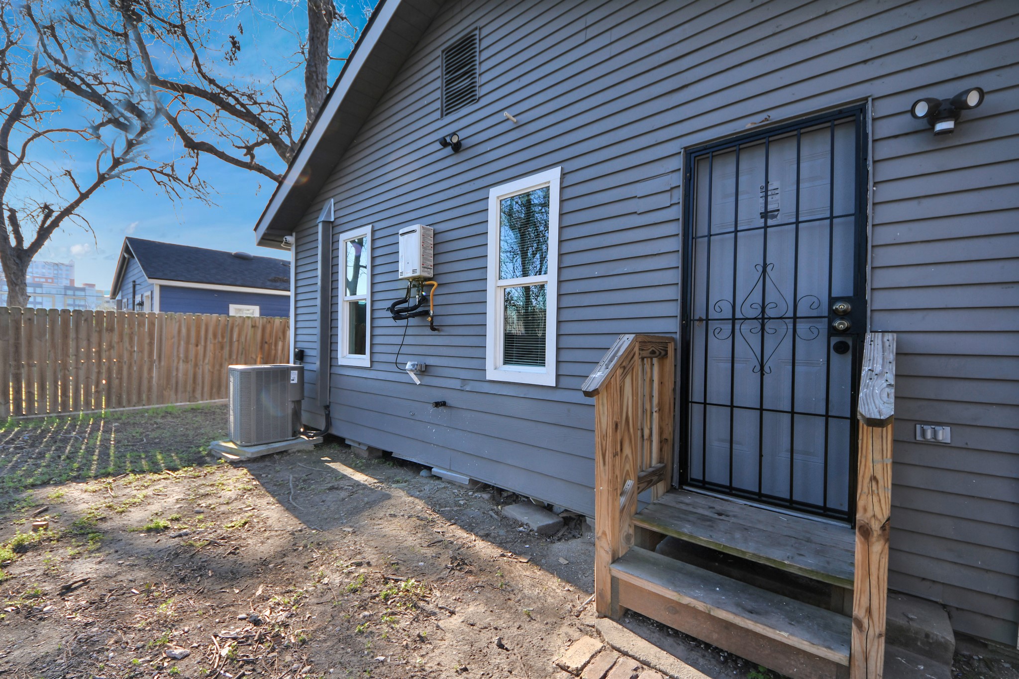 3423 Beulah Street Houston, TX 77004 - Photo 31 of 36 a view of a deck with a table and chairs and wooden fence