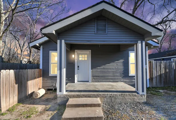 a front view of a house with a glass door