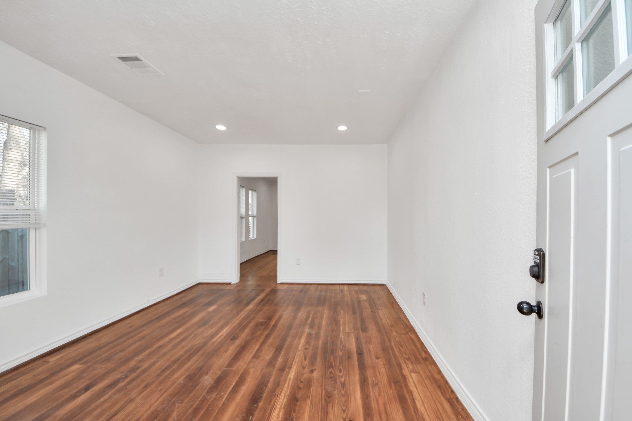 3423 Beulah Street Houston, TX 77004 - Photo 6 of 36 a view of a room with wooden floor and white walls
