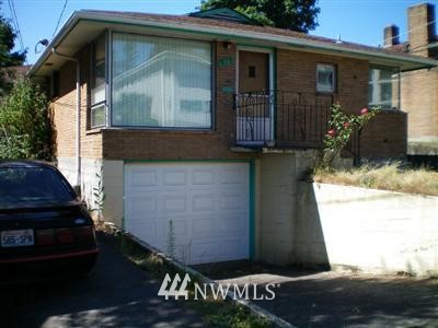 a front view of a house with garage