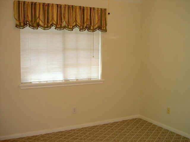 4542 Springfield Lakes Street Sugar Land, TX 77479 - Photo 14 of 16 Additional bedroom offering versatile space for family, guests, or a home office.