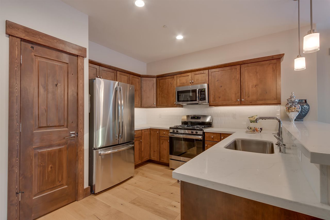 11679 McClintock Loop, Unit 1 Truckee, CA 96161 - Photo 4 of 19 a kitchen with a refrigerator stove and sink