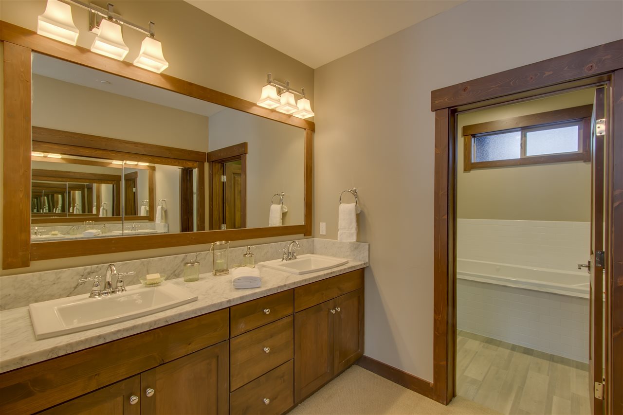 11679 McClintock Loop, Unit 1 Truckee, CA 96161 - Photo 7 of 19 a bathroom with a sink and a mirror