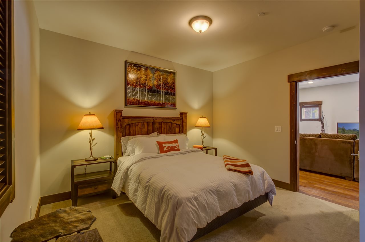 11679 McClintock Loop, Unit 1 Truckee, CA 96161 - Photo 9 of 19 a bedroom with a bed and a couch